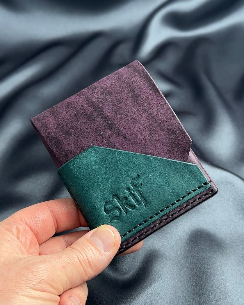 slim snap leather wallet closed in hand FUSION model
