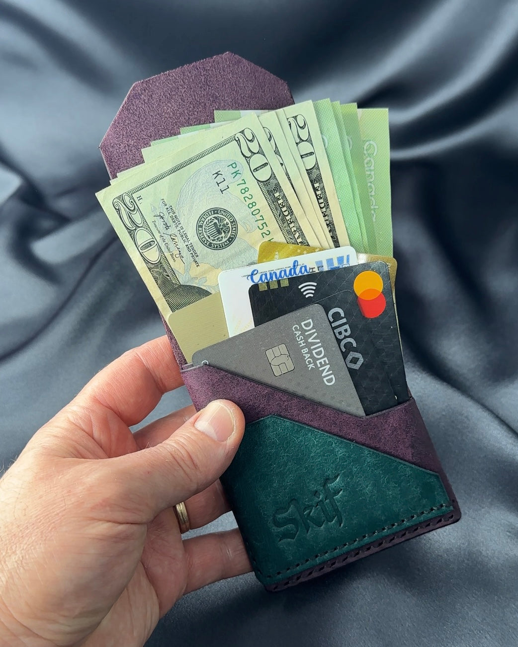 slim snap leather wallet with cards and cash in hand FUSION model