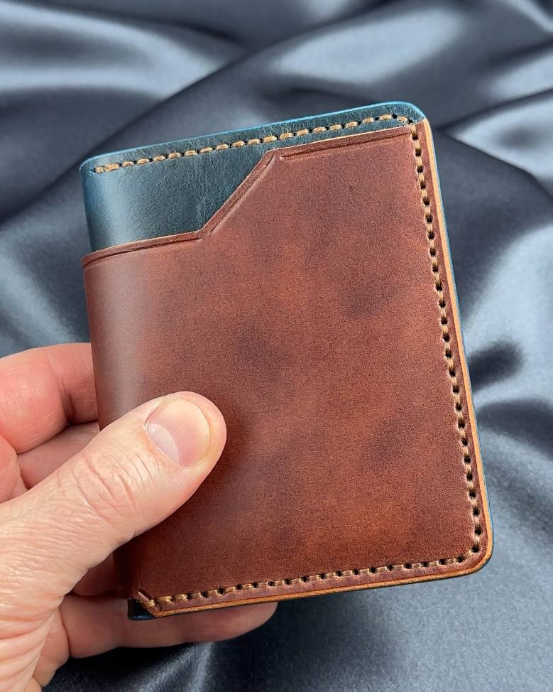 vertical bifold leather wallet exterior in hand VERTEX model