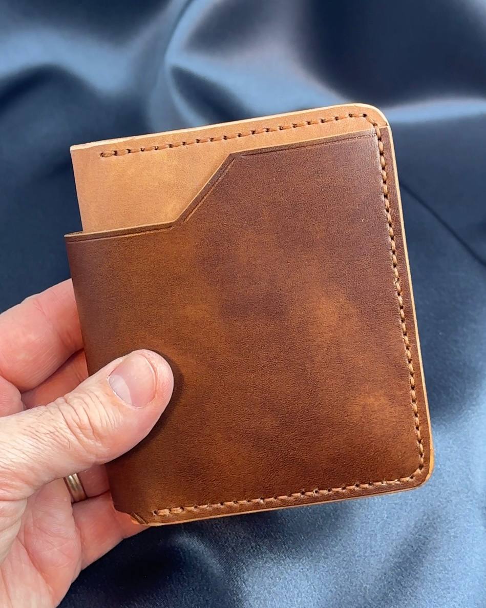 vertical bifold leather wallet exterior in hand VERTEX model