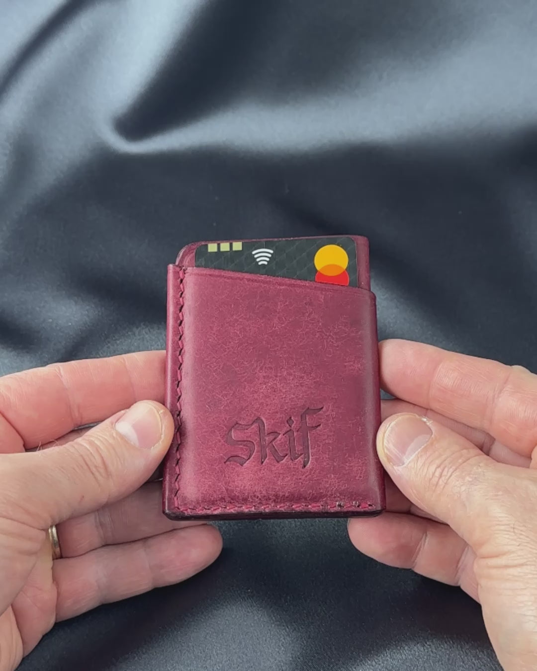 leather card holder in hands usage demonstration SOLO model video