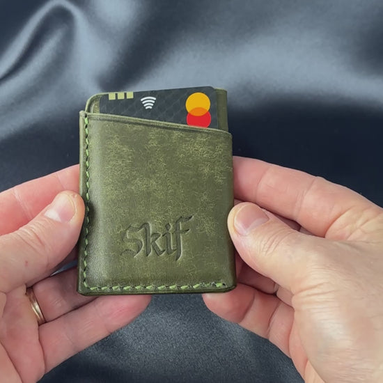 leather card holder in hands usage demonstration SOLO model video