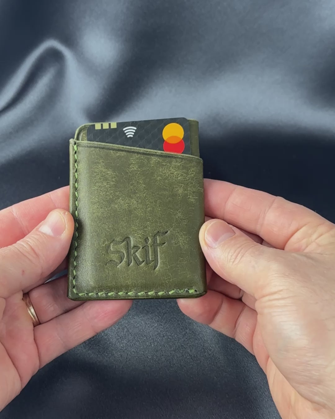 leather card holder in hands usage demonstration SOLO model video