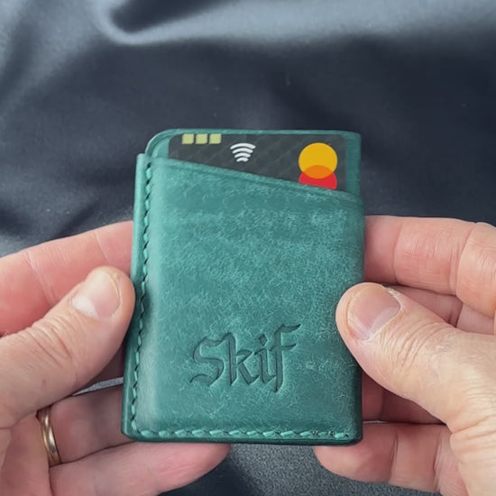 leather card holder in hands usage demonstration SOLO model video