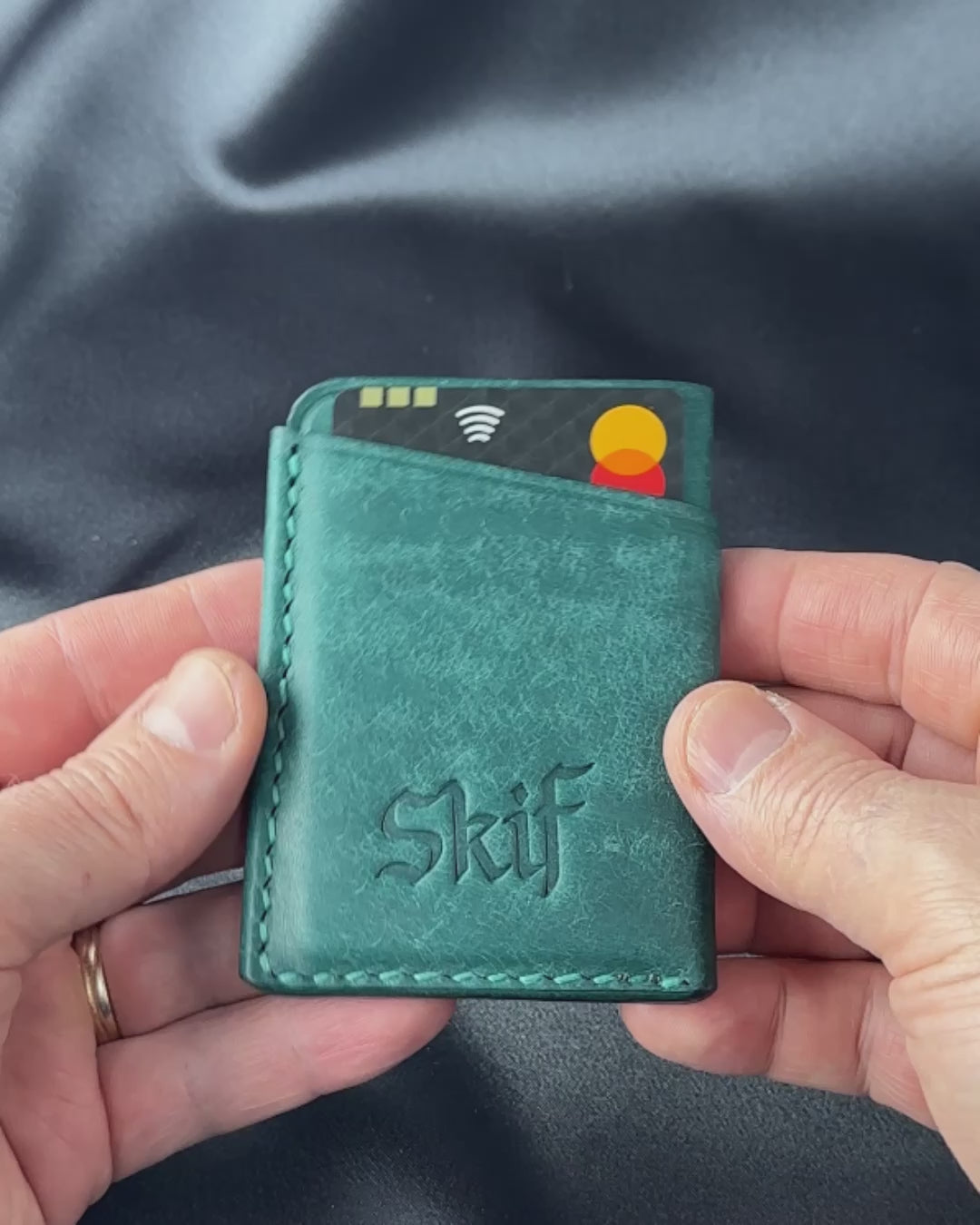 leather card holder in hands usage demonstration SOLO model video