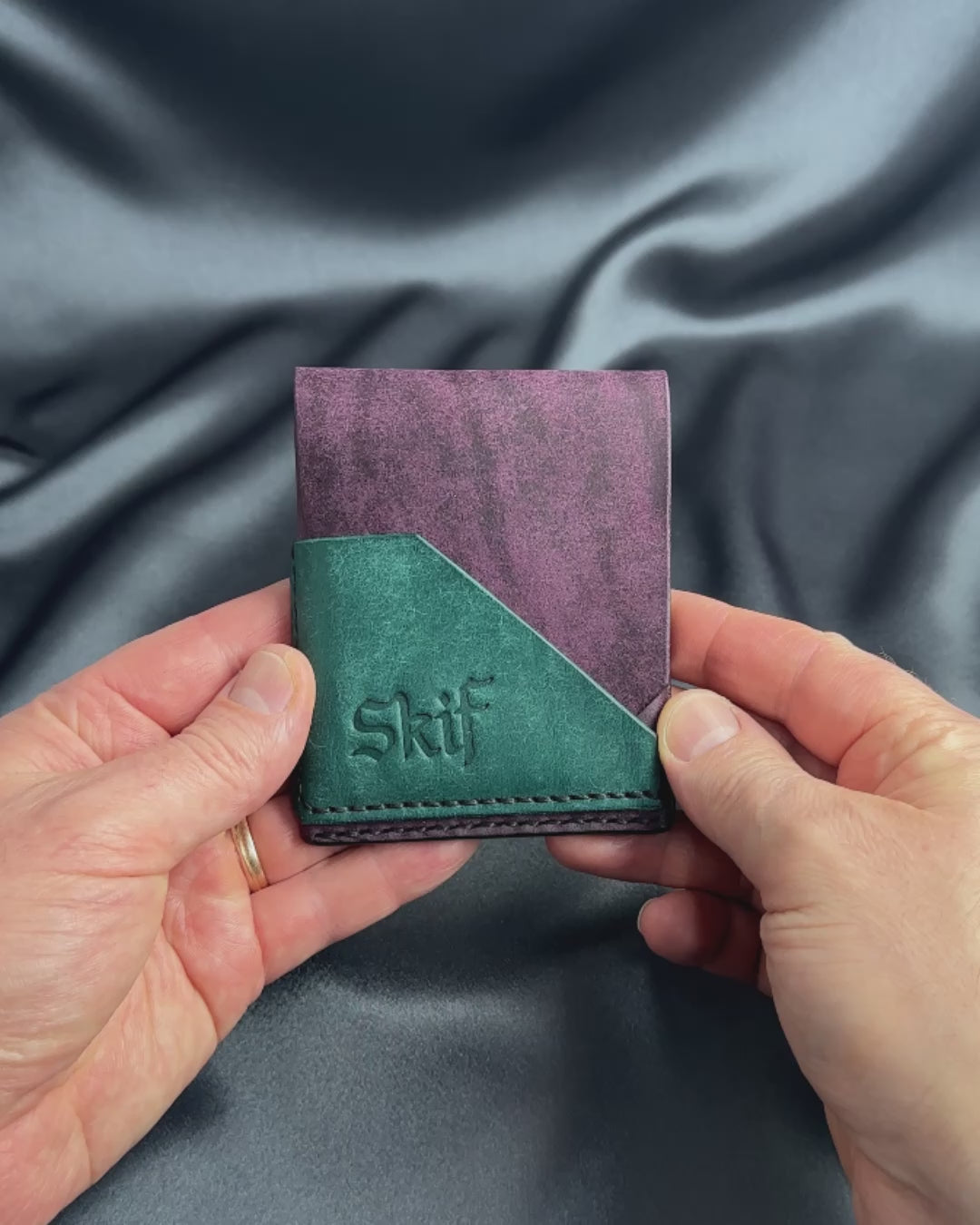 slim snap leather wallet in hands video FUSION model